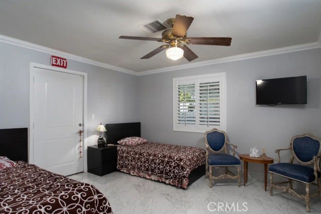 Bedroom with access to pool.