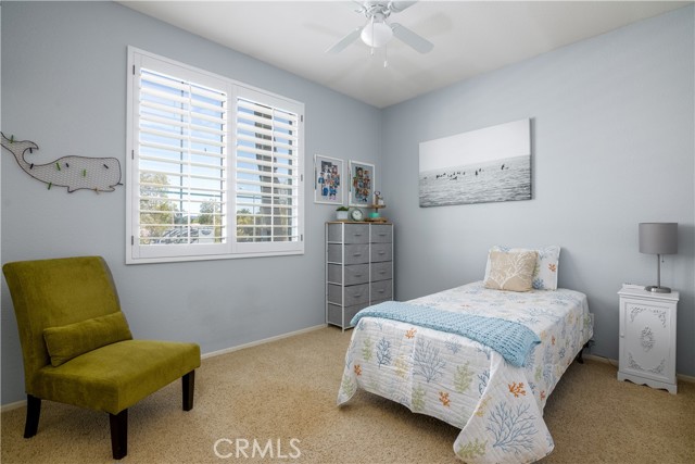 #2 secondary bedroom with mirrored closet doors.