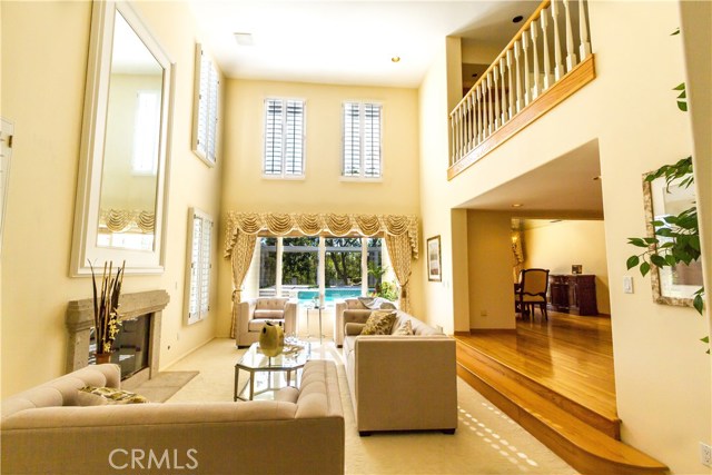 Nice view from living room to backyard with beautiful pool.