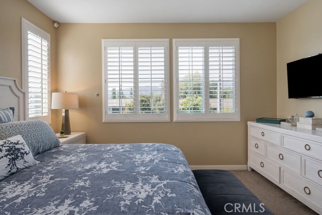 Primary bedroom offers mountain views