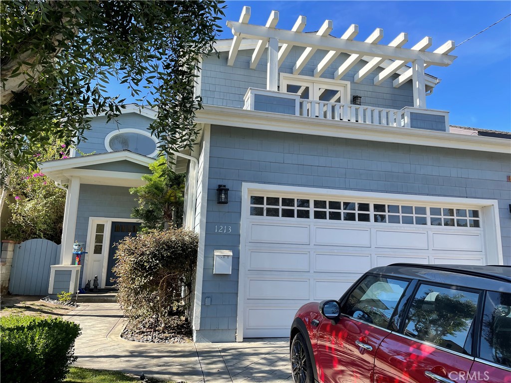 1213 Walnut Avenue Manhattan Beach, California Cape Cod home set in the prominent tree section neighborhood of Manhattan Beach. A grassy front yard leads to the spacious living room complete with cathedral ceilings and stone fireplace. The formal dining room and large kitchen provides a great space for entertaining. The fully equipped kitchen features a center island, bar seating, dining nook, and stainless-steel appliances; all which open to the family room. This part of the home offers an all-inclusive gathering place to include a rear patio and landscaped back yard that is protected by a fence and high trees offering additional privacy. One bedroom and one full bath can also be found on the main level. The second story features four bedrooms, three baths, and laundry room. The sizeable main suite is designed with high ceilings, a large walk-in closet, private balcony overlooking the back yard, and a two-way fireplace that extends to the bath with jetted tub, separate shower, and dual vanities. This is an incredible opportunity to be a part of this exceptional community just minutes from the beach, downtown Manhattan, greenbelt, and highly rated schools.