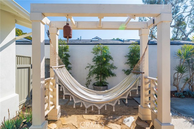 The hammock pergola invites you to relax and enjoy your front yard