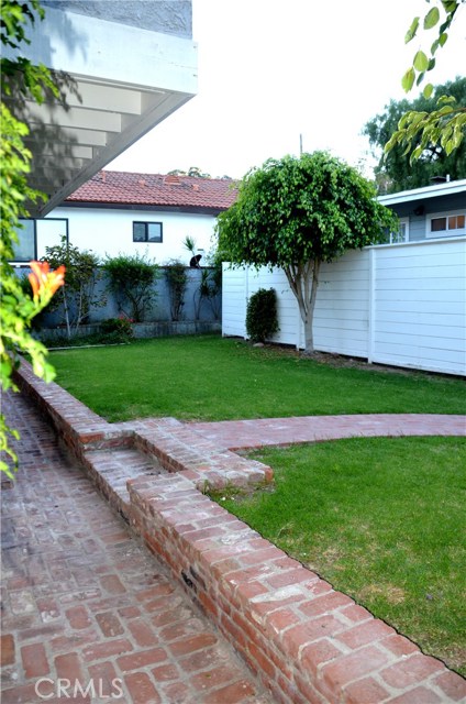 Shared private yard to enjoy and there is a balcony from this home that overlooks.