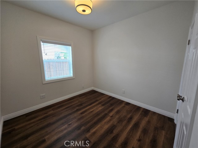Good sized guest bedroom with a nice sized closet and natural light.