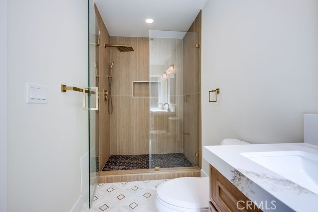 Master Bath #2 New from top to bottom including bamboo style tile, custom glass enclosure, quartz countertop, Cabinetry, Sinks, Mirrors, Fixtures & Hardware.