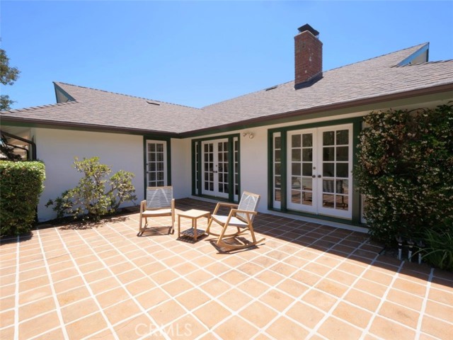 Continue the tour to the back of the house showing the French doors from the back of the family room, from the living room, from the fourth bedroom/office and of course the large patio.