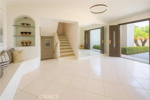 Entry leads downstairs to family room and up to bedrooms.
