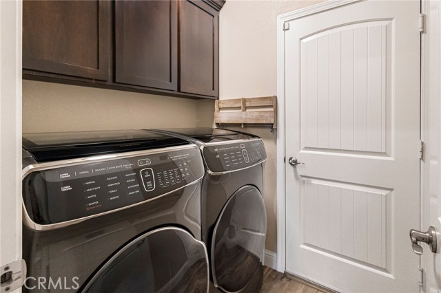 Indoor laundry room with garage access.