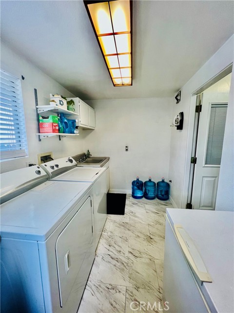 Spacious enclosed Laundry Room with Utility Sink