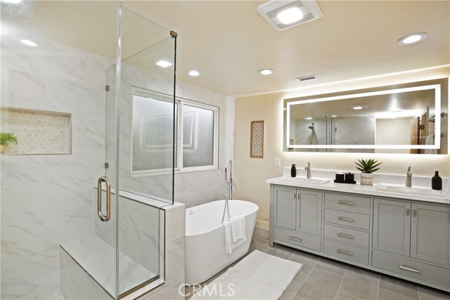 Primary bathroom with new shower, separate tub and dual sinks