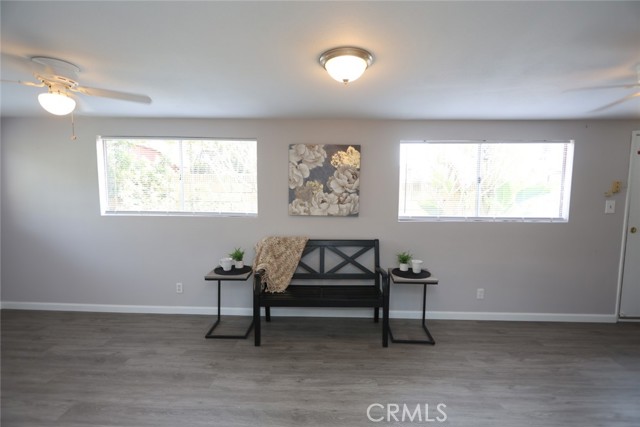 Family room, new laminated flooring, fresh paint, with access to the side yard and back yard