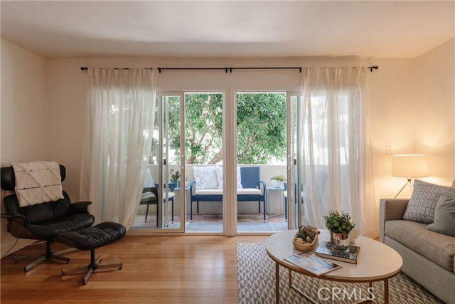 Living room opens to private balcony