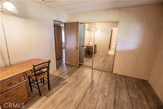 Guest bedroom with mirrored closet
