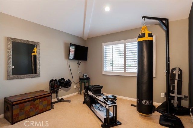 1 of 4 bedrooms, currently being used as a gym/workout room