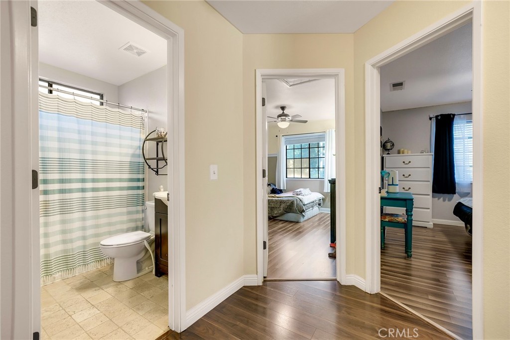 There are two bedrooms and the guest bathroom where the main hallway ends.