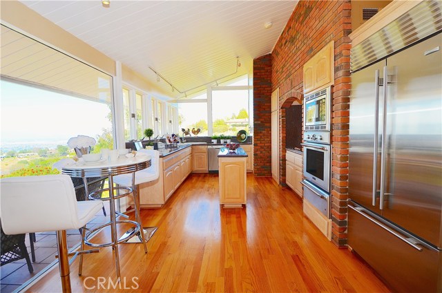 Stainless steel, granite and hardwood are easily appreciated in this bright and airy kitchen.