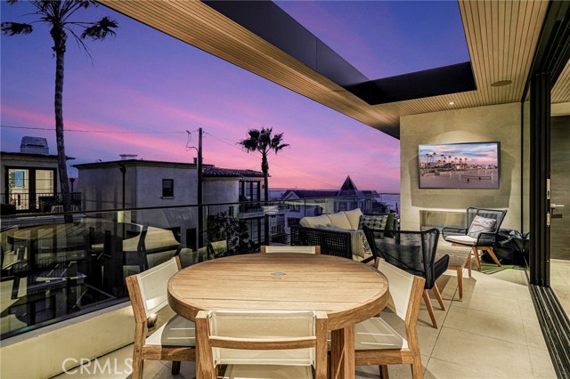 Twilight view of the deck with the Fleetwood doors open to the kitchen