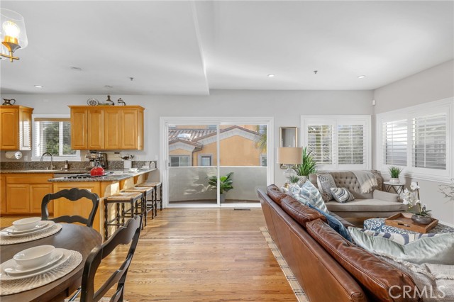 Warm wood floors, wood shutters and recessed lighting create a cool coastal vibe.