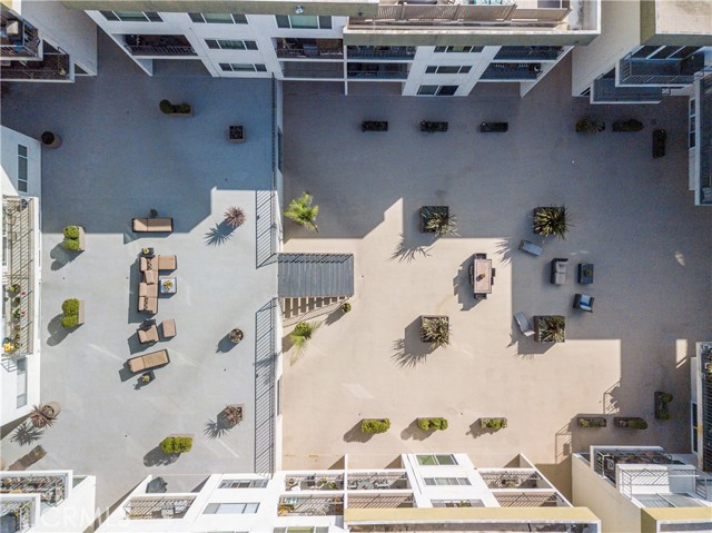 Two story courtyard with multiple seating areas.