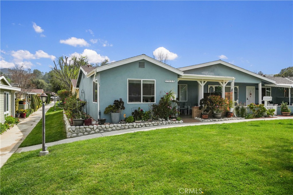 True pride of home-ownership shows throughout over $90k of upgrades including: full Kitchen remodel with newer cabinets, quartz countertops, stainless-steel appliances, wood-like-style-tiles, indoor LAUNDRY appliances plus a laundry sink, and LED lighting. All Kitchen and Laundry appliances included. Other upgrades include: Luxury vinyl planks, tile flooring in the bathroom, dual-pane vinyl windows, HVAC replaced in 2022, LED recessed lighting, a remodeled Bathroom with a newer vanity and shower, and a remodeled porch with newer tiles. Welcome Home to Friendly Valley! A 55+ master planned guard-gated community, located in the City of Santa Clarita, area of Newhall, and surrounded by a luscious green golf-course! Association amenities include (but not limited to): 18 hole pitch & putt golf course, maintenance of recreational facilities and streets, security, office staff, cable and internet TV, trash and water for your front yard, swimming pool, clubhouse, tournament-style lawn bowling field, basketball court, a woodwork shop, ceramic shop, and RV parking facilities.