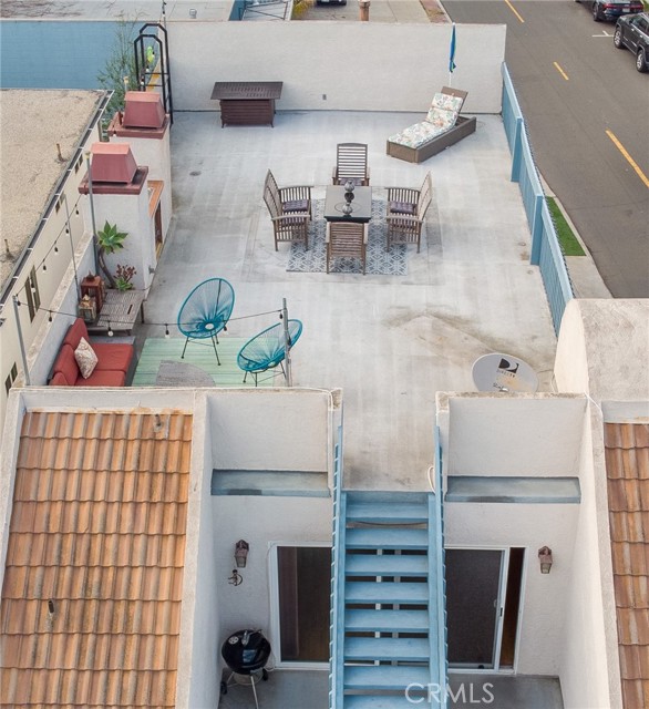 Stairs up to large rooftop deck