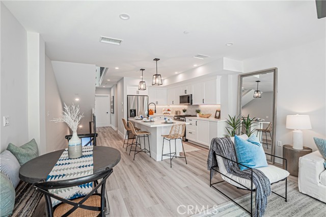 Main living area with access to upper and lower staircase.
