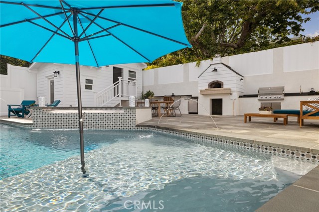 Baja Lounge Area with Full Outdoor Kitchen as a Backdrop