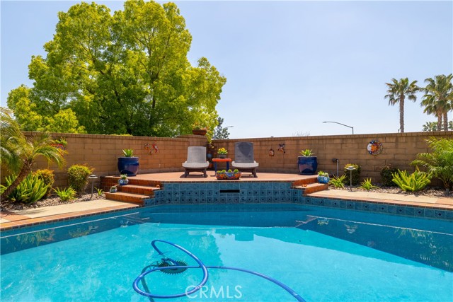 Gorgeous pool with seating area.