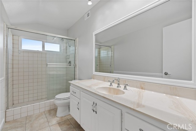Upstairs hallway bath with a tile shower and a vanity area!