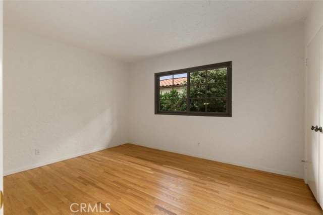 This bedroom has a newer wood floor and large closet.