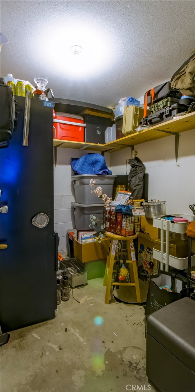 Separate walk-in storage room in garage area.