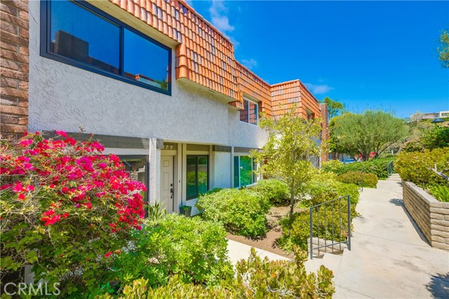 Front walkway to unit. Lush landscaping.