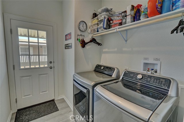 LAUNDRY ROOM WITH WASHER/DRYER HOOKUPS AND ACCESS TO CARPORT