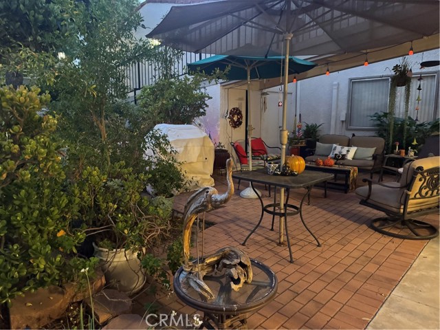 Prefer a change of scenery? Enjoy your morning coffee or tea on the front patio, offering a welcoming alternative to the private backyard retreat