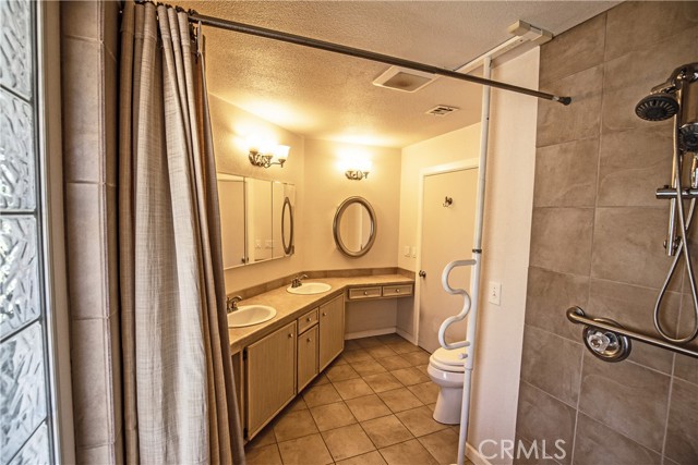 Step-in tiled shower in primary bathroom
