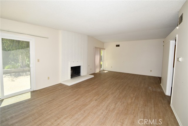 Living room facing landscaped backyard