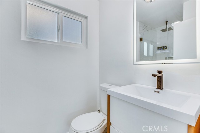 Bathroom 2. New Energy Efficient Dual Panel Windows. New Toilet / Sink / Mirror.