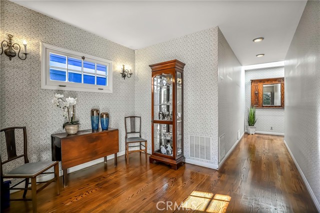 Formal Foyer entryway with skylights and casement window