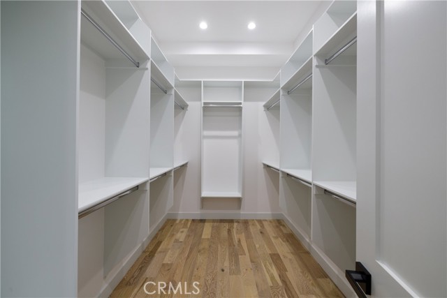 Spacious Walk-in Closet with Built-in Storage Solutions