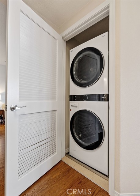 Inside laundry - stackable units hidden in the hallway.