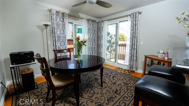 Dining Area with two sliders and access to balcony and side patio
