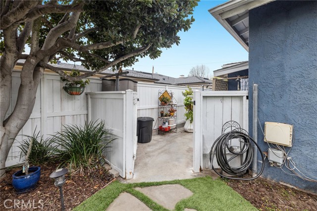 From the backyard to not one.. two outdoor showers, good sized side areas for plants and more. There is storage room if needed too. Newer fence and gate.