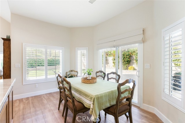 The breakfast nook area has lots of windows and a door to the back patio.