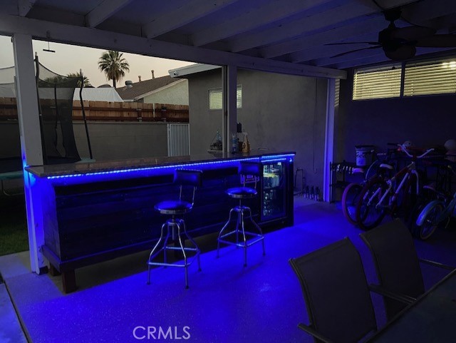 Backyard patio with outdoor bar - evening