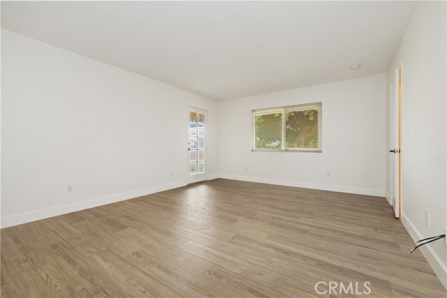Primary bedroom with access to back patio