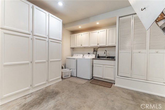 Garage laundry with storage and sink