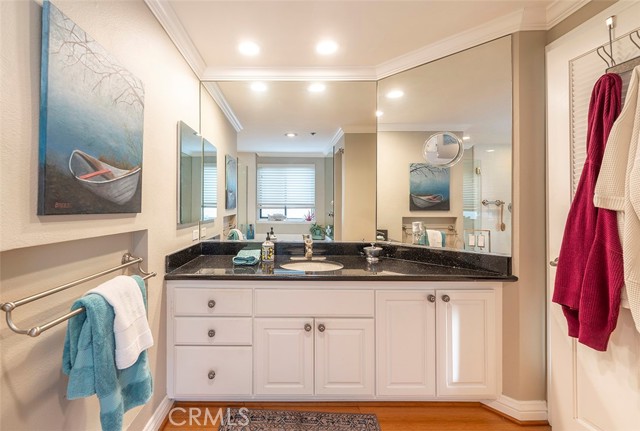 Primary bath with updated vanity with granite countertop