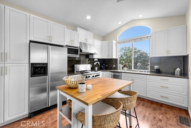 Kitchen has lots of cabinets.