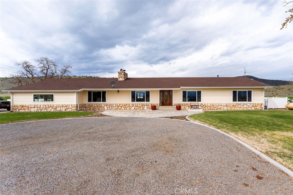 Yearning for a bit more room - inside and out!?  Take a look at this property!  Featuring a 4bdr/2.5 bath home with approx. 3,769 sq.ft. and a 3-car garage w/approx. 864 sq.ft., all on 57.88 acres!  Updated, single level home w/open floor plan, large rooms, and plenty of light.  Custom kitchen featuring SS appliances that include a microwave, dishwasher, trash compactor, warming drawer, and double ovens, granite tile counters, tile backsplash & so much more!  Master ensuite features a large walk-in closet, propane fireplace, spacious bath including jetted tub, walk-in shower, partially heated tile flooring, dual sinks, & dual shower heads.  Home features multiple ways to heat & cool including brand new mini-split systems, heat pump heat & air, gas & wood fireplaces & newer woodstove.  A large, comfy family room w/surround sound, separate wet bar area for entertaining, living room w/grand fireplace, picture windows w/great views & spacious bedrooms make this home a MUST SEE!!  

The grounds of the home feature stone & concrete patios, trex type decking, landscaping front & back, covered patios w/outdoor BBQ island w/sink & refrigerator, an in-ground salt-water pool & pool house, garden beds & plenty of room for RV parking.   Over the past few years, many updates have been made to this property!  Electrical panels have been replaced, including one w/surge protection, generator backup plug-in was installed, exterior & interior of home professionally painted, brand new water softener installed & so much more!  List of improvements available by request.  

Land is currently planted in Winter Triticale this year.  Last year's crop was Winter Rye & did well.  Property is in the Grenada Irrigation Water District and also features an Ag well & 2 domestic wells.  There is a 40 ft. container by barn for extra storage as well as 1 large grain bin.  Perfect for the mini-rancher.

NOTE:  The accuracy of the information provided is deemed reliable but is not guaranteed, is subject to change, and should be independently verified.  Owner is a California Licensed Real Estate Broker.  Some photos are from different times of year.