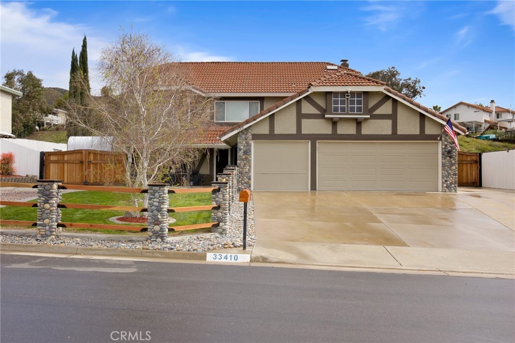 33410 Maple Tree Lane Wildomar, California Welcome to stunning 33410 Maple Tree Lane.Meticulously maintained home located on a peaceful cul-de-sac.As you arrive there is high quality landscaping and an attached 3 car garage.There are two impressive access gates that lead to the incredible expansive backyard.Entering this warm and inviting home is the regal entryway.The living room is to your left,has natural light from the double pane windows that are throughout this home.Stepping into the remodeled kitchen that has custom granite counter tops and all appliances included.The dining area can accommodate a large gathering with a cozy fireplace and abundant built in storage.A sliding door to venture into the backyard and large pet house with gates located outside.All bathrooms are remodeled with top quality materials.The half bathroom located downstairs is darling with wainscoting.Inside laundry area with side by side washer/dryer combo included.The direct access to the garages located at end of this hallway.As you venture upstairs on a majestic staircase with an elegant banister ,the landing above is impressive with storage cabinets and counter top. Bedrooms are spacious with ample closet space.The full hallway bathroom has been beautifully remodeled.Making way into the main bedroom with a large walk-in closet and en-suite bathroom,remodeled with double sinks and high materials .Exquisite bathroom.This bedroom has sliding doors that lead to an outdoor deck.Such a nice benefit to have.Now ,lets talk about this dream backyard .There is an inviting built in fire pit with seating to match.A pergola ,large gardening shed/plant house.Amazing hobby shops with a full bathroom,Ben Pak car lift,compressor and covered parking area.So much room for car enthusiasts/RV's/boats and water toys,etc.Use your imagination! All is very nicely hard scaped with built in drainage.Beautiful plants ,flowers and fruit trees.You will appreciate all the thoughtful details and attention to features throughout.Ideally close to shopping ,dining, entertainment and freeway access.This home is a must see to fully appreciate all that is offered!